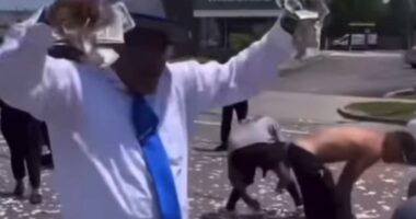 Chaos in Detroit as dead man's fortune is dropped from helicopter