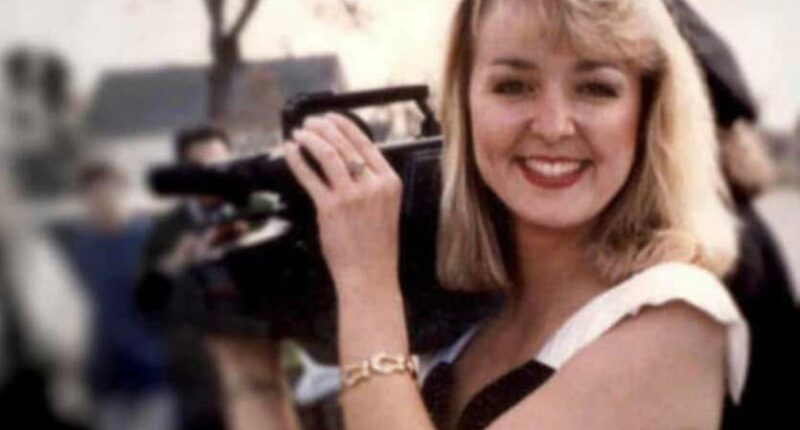 Photo of Jodi Huisentruit holding a video camera.