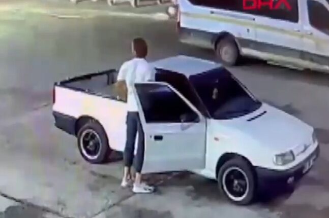Screenshot of a video showing a person filling bottles with petrol, along with a van and a pickup truck.