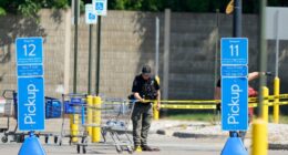 Police investigating a stabbing scene at a Walmart.