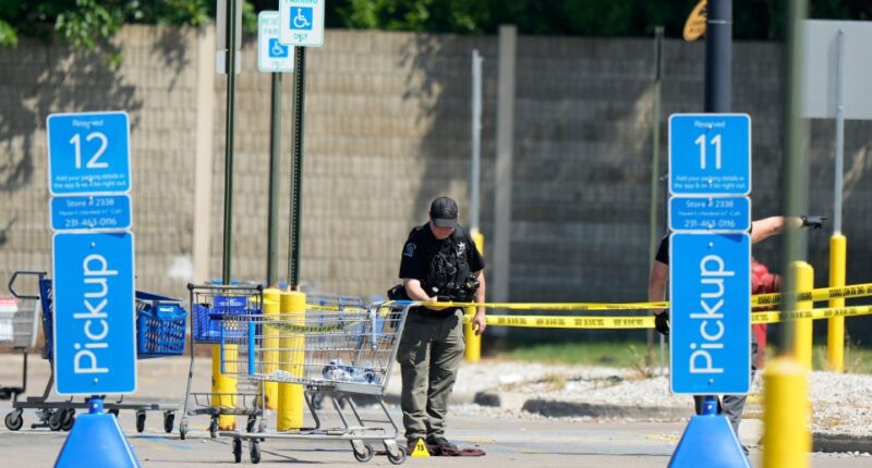Police investigating a stabbing scene at a Walmart.