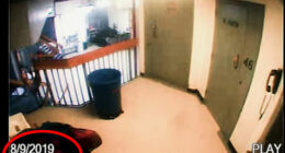 Security camera footage of a hallway.