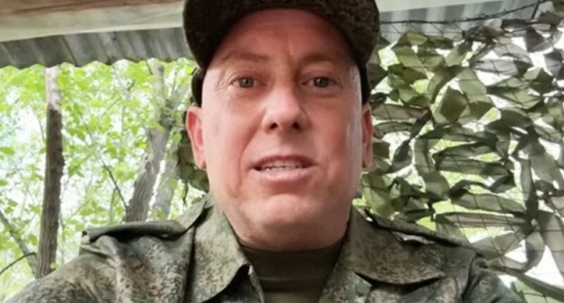 Close-up of Derek Huffman in military uniform.
