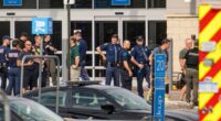 Law enforcement officers at a crime scene.