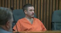 Joseph Antonsen in an orange prison jumpsuit at his sentencing.