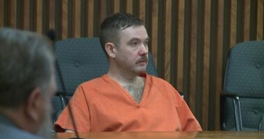 Joseph Antonsen in an orange prison jumpsuit at his sentencing.