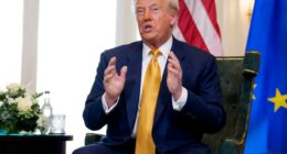 Donald Trump speaking at a meeting.