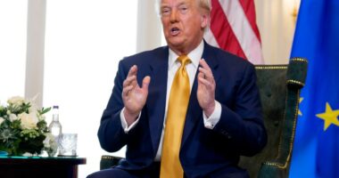 Donald Trump speaking at a meeting.