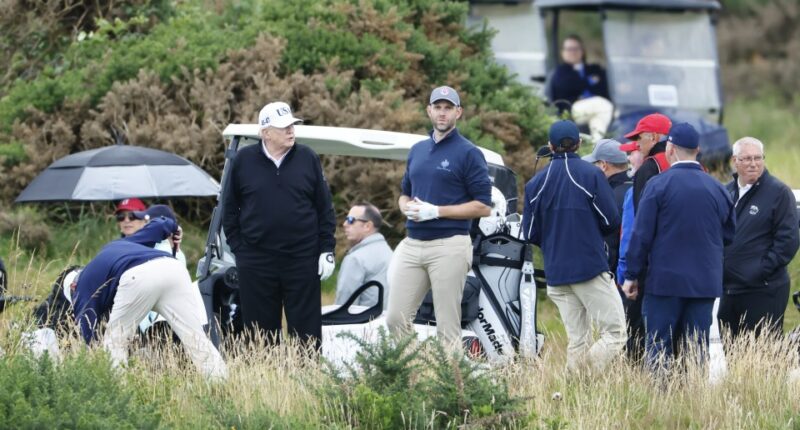 Donald Trump and Eric Trump preparing to play golf.
