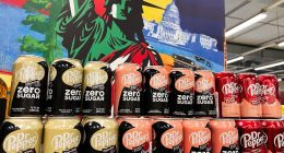 Kyiv, Ukraine - February 04, 2025: A colorful display of Dr Pepper Zero Sugar cans with a patriotic background.