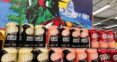 Kyiv, Ukraine - February 04, 2025: A colorful display of Dr Pepper Zero Sugar cans with a patriotic background.