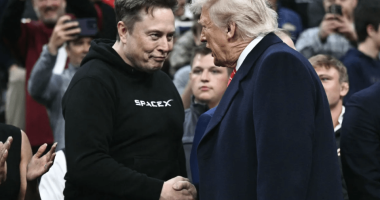 Elon Musk and Donald Trump shaking hands.