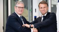 Keir Starmer and Emmanuel Macron shaking hands at a press conference.