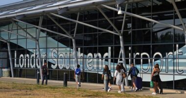 Passengers walking outside London Southend Airport.
