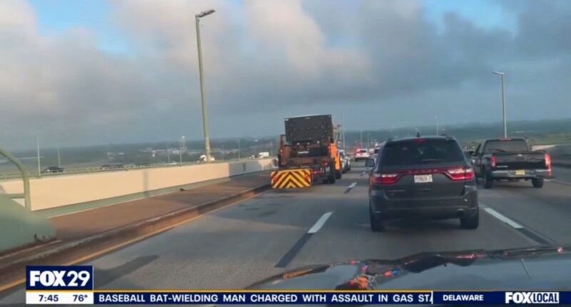 Traffic jam on a bridge due to a tractor-trailer accident.