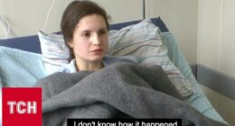 Injured woman in hospital bed.