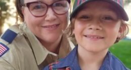 Photo of a mother and son, both wearing Boy Scouts of America uniforms.