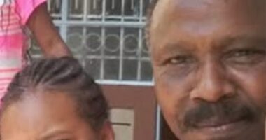 Photo of a man and his granddaughter.