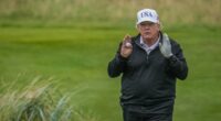 Donald Trump playing golf.