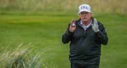 Donald Trump playing golf.