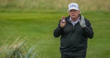 Donald Trump playing golf.