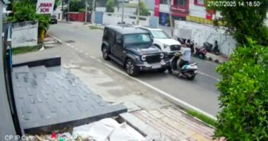 Security camera footage of a car hitting a scooter.