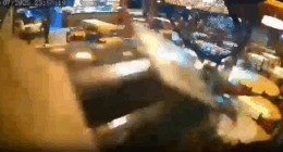Security camera footage of a blurry altercation in a restaurant.