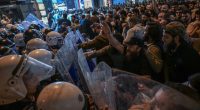Protesters clashing with riot police in Istanbul.