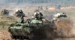 Belarusian army vehicles driving during war games.