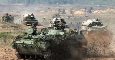 Belarusian army vehicles driving during war games.
