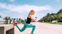 Young woman has an outdoor workout on the sea embankment