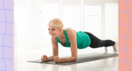 fit mature woman doing forearm plank in bright room
