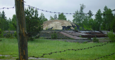 Barbed wire fence in front of an abandoned Soviet-era nuclear missile base.