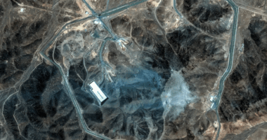 Aerial view of a facility surrounded by a perimeter road.