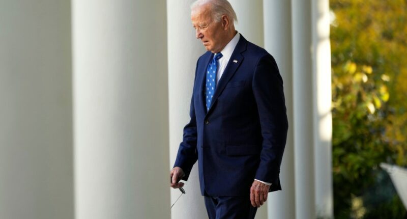 President Biden walking in the White House Rose Garden.
