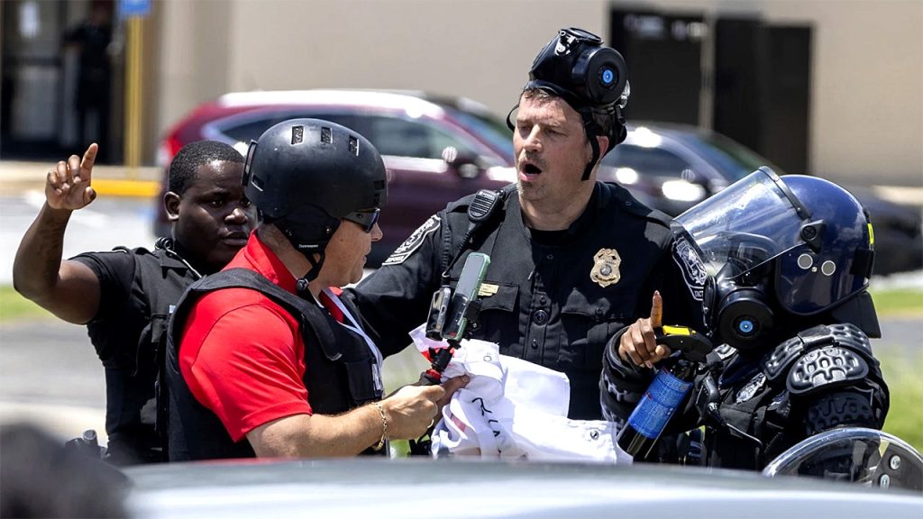 Journalist arrested while covering anti-Trump protest granted bail amid deportation battle