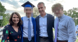 Family photo at a graduation ceremony.