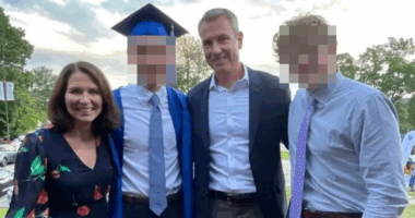 Family photo at a graduation ceremony.