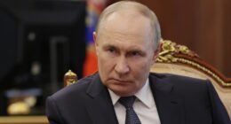 Vladimir Putin in a meeting.