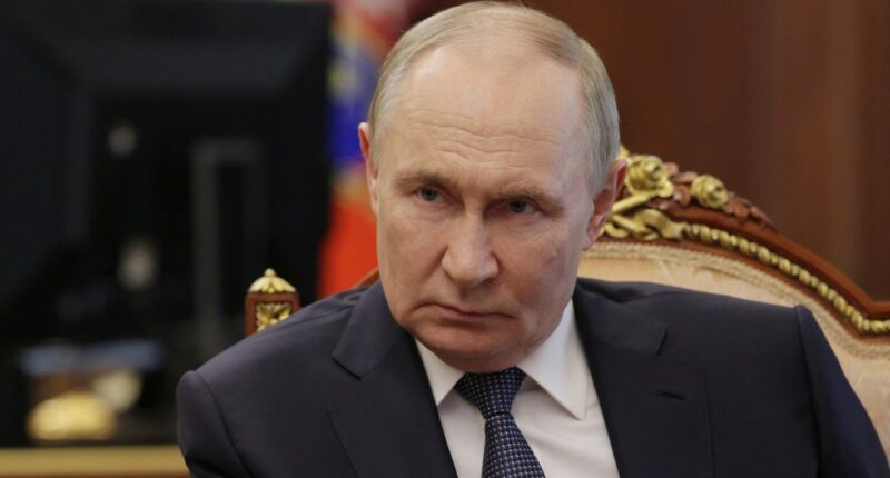 Vladimir Putin in a meeting.