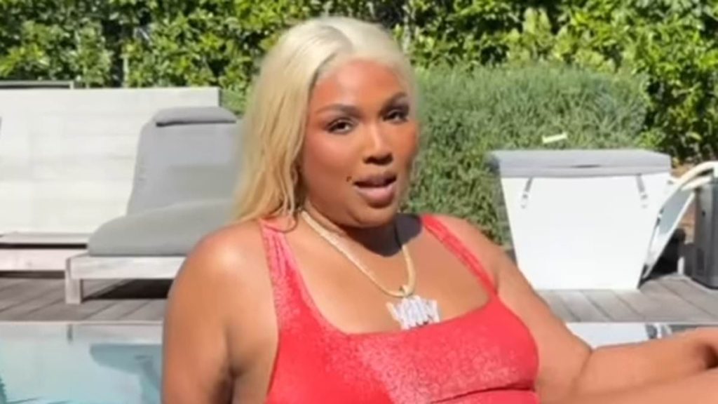 Lizzo channels Baywatch star Pamela Anderson in iconic red swimsuit