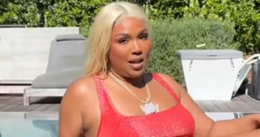 Lizzo channels Baywatch star Pamela Anderson in iconic red swimsuit