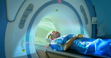 Woman undergoing an MRI scan.