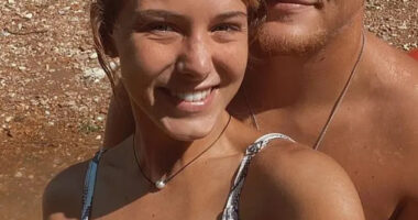 A young woman and man smiling for a selfie.