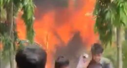 People watching a large fire.