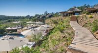 Gondwana Private Game Reserve resort with a wooden walkway and pool.