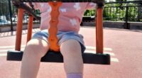 Toddler on a swing.