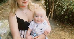 A woman holding a baby on her lap.