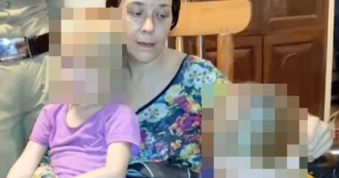 A Russian woman and her two young daughters, faces blurred for privacy, found living in a cave.