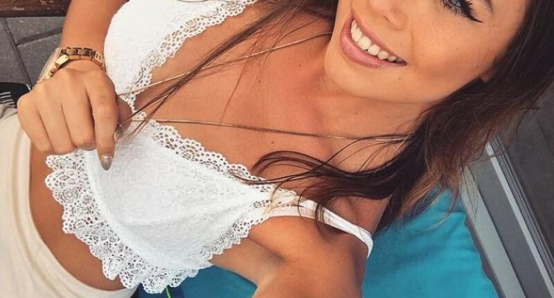 Selfie of Ivana Smit in a white lace top.